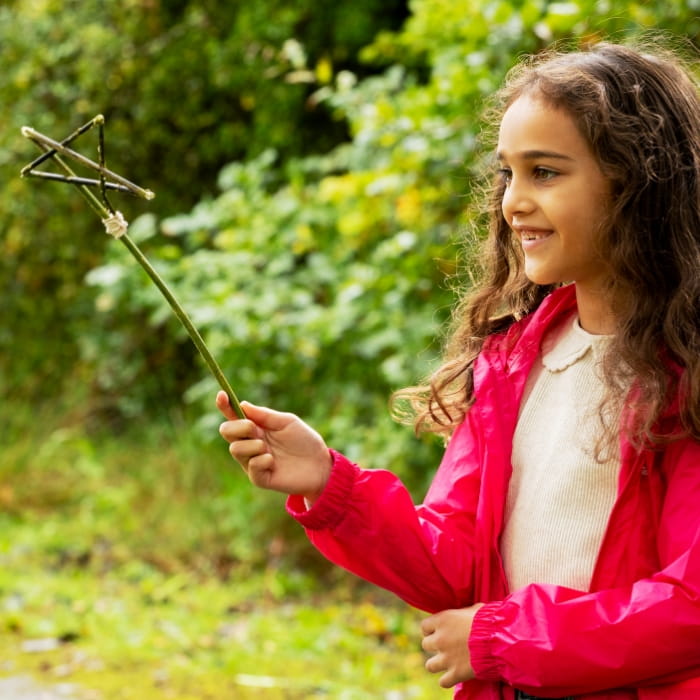 Girl with pentagram on a stick